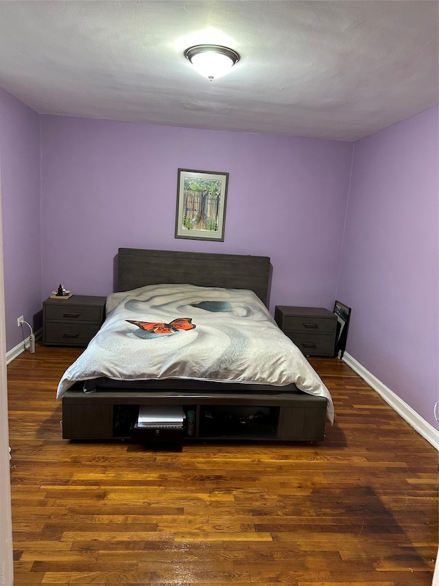 bedroom featuring dark hardwood / wood-style floors