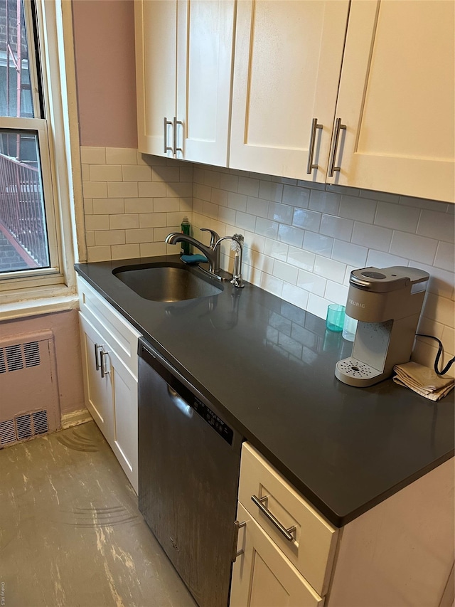 kitchen with backsplash, stainless steel dishwasher, sink, white cabinets, and radiator heating unit