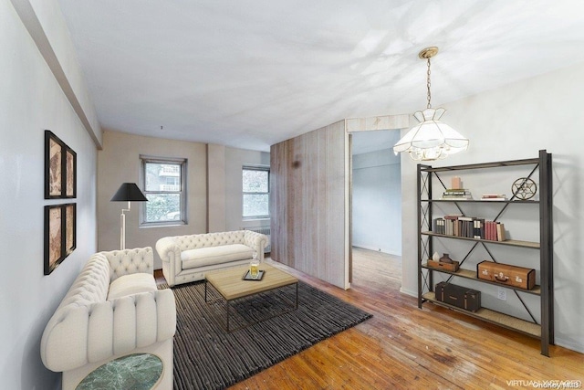 living room with a chandelier and hardwood / wood-style floors