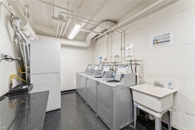 washroom featuring independent washer and dryer and sink