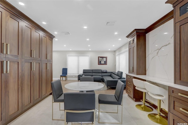 dining room featuring a wealth of natural light and light tile patterned floors