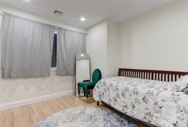 bedroom with wood-type flooring