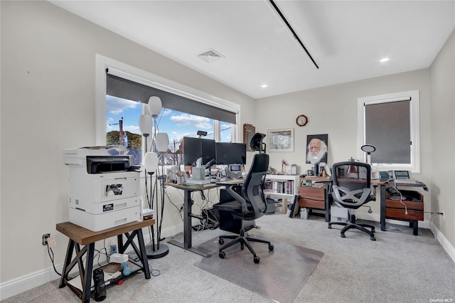 office area featuring light carpet