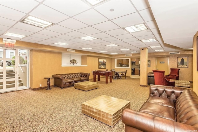 carpeted living room featuring a paneled ceiling and pool table