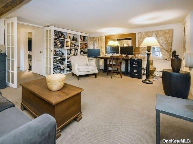 living area featuring carpet flooring and french doors