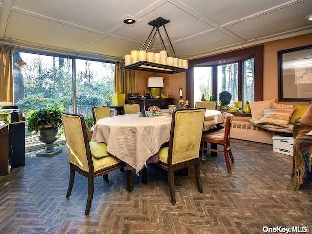 dining room featuring dark parquet flooring and coffered ceiling