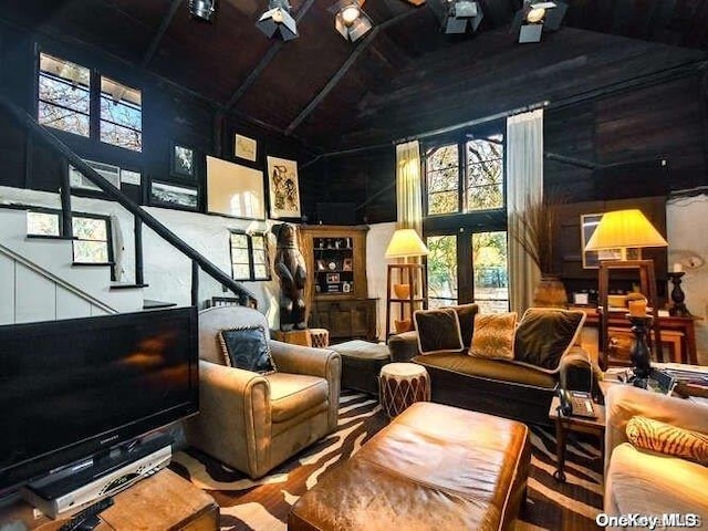 143 Piping Rock Rd, Locust Valley, NY 11560 - living area with high vaulted ceiling, healthy amount of natural light, stairs, and wood ceiling