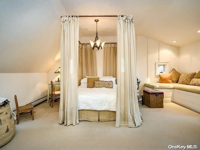 bedroom featuring carpet flooring, vaulted ceiling, and an inviting chandelier