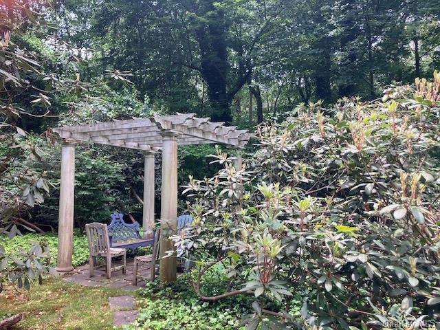 143 Piping Rock Rd, Locust Valley, NY 11560 - view of yard with a pergola