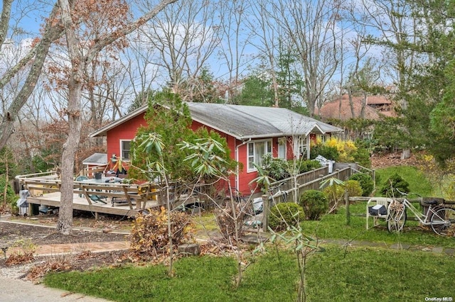 view of side of property with a wooden deck