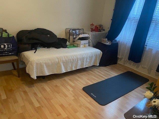 bedroom with wood-type flooring