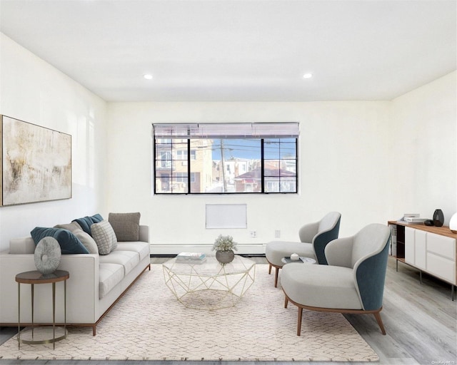 living room featuring light hardwood / wood-style floors and a baseboard radiator