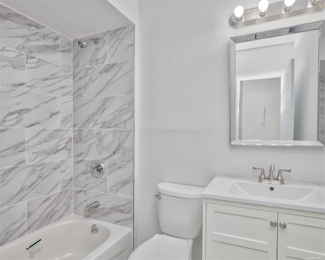 full bathroom with tiled shower / bath combo, toilet, and vanity