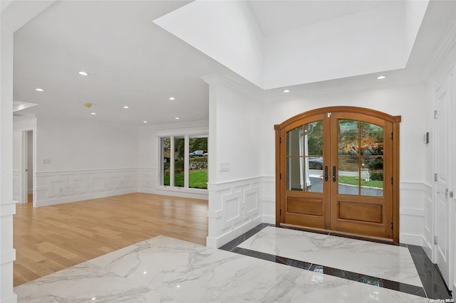 entryway featuring french doors and hardwood / wood-style flooring