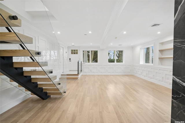 unfurnished living room featuring light hardwood / wood-style flooring