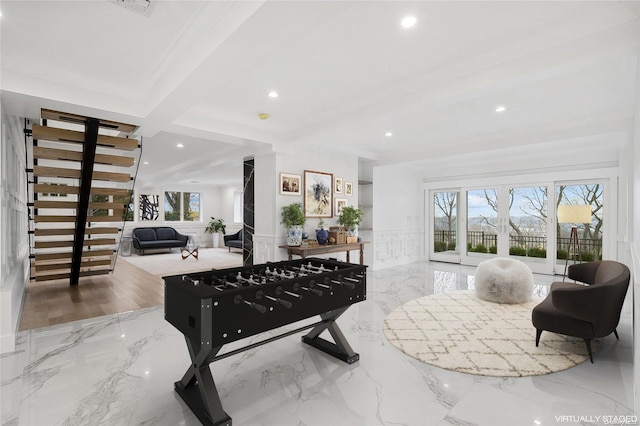 playroom featuring beamed ceiling