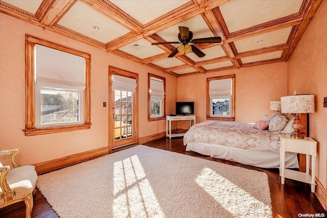 bedroom featuring ornamental molding, coffered ceiling, ceiling fan, beamed ceiling, and dark hardwood / wood-style floors