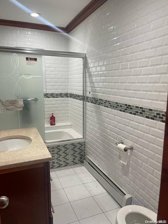 full bathroom featuring vanity, baseboard heating, crown molding, shower / bath combination with glass door, and toilet