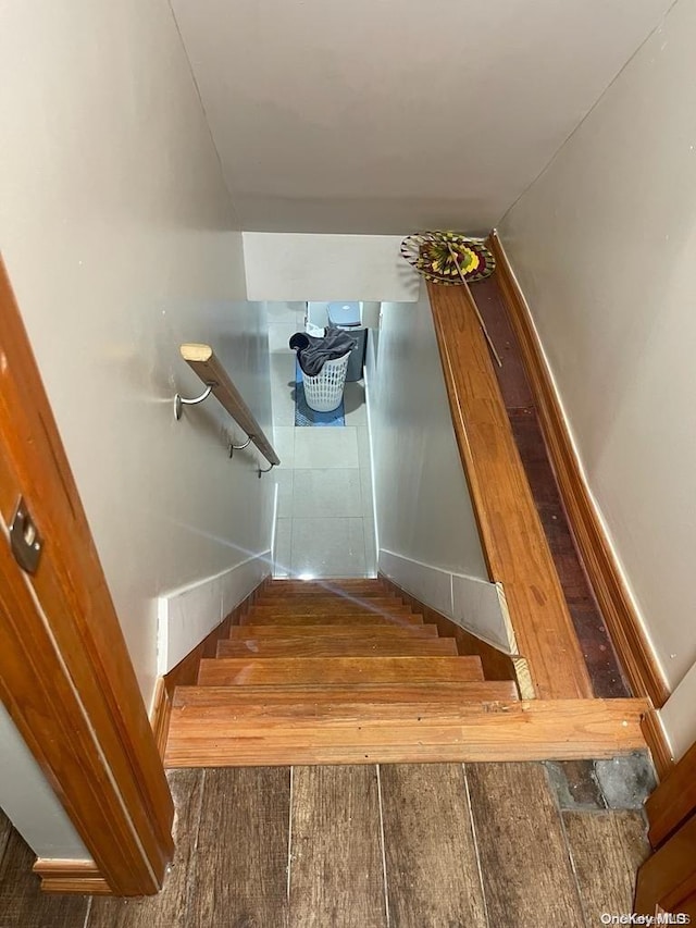 staircase featuring hardwood / wood-style flooring