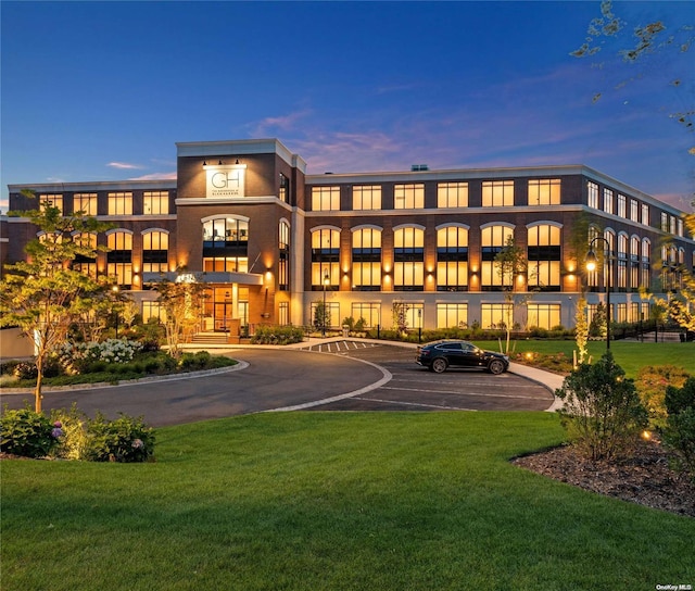 view of outdoor building at dusk