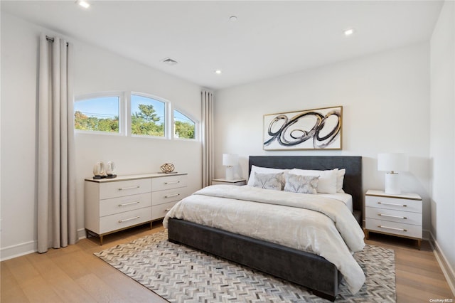 bedroom with light hardwood / wood-style floors