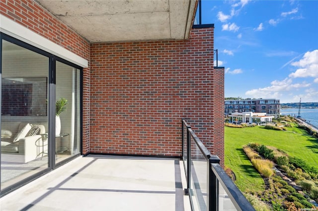 balcony featuring a water view