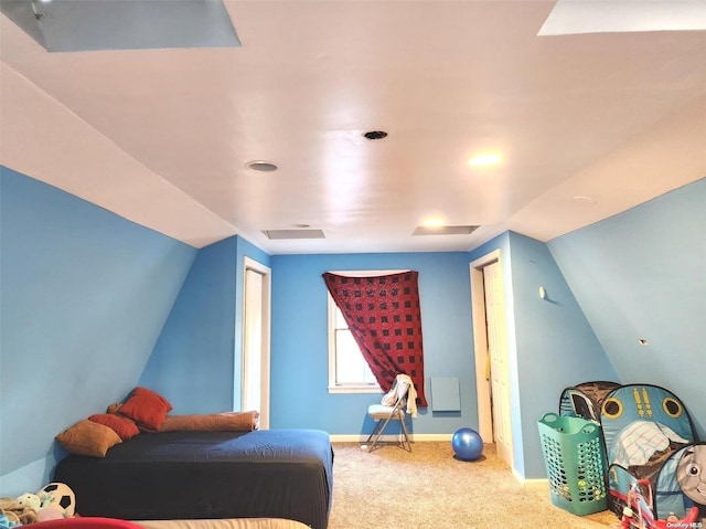 carpeted bedroom featuring vaulted ceiling