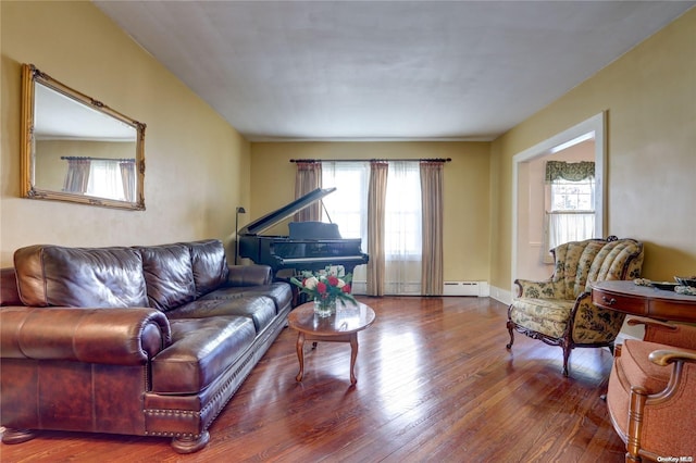 living room with wood-type flooring and a baseboard radiator