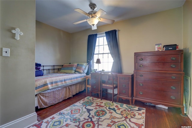 bedroom with ceiling fan and dark hardwood / wood-style floors