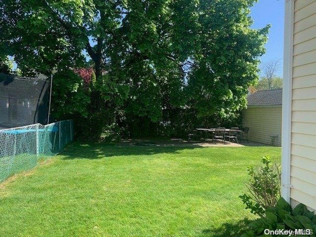 view of yard with a trampoline