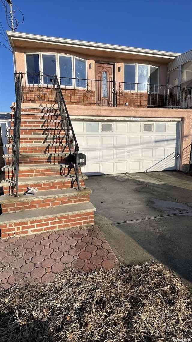 view of front of property with a garage