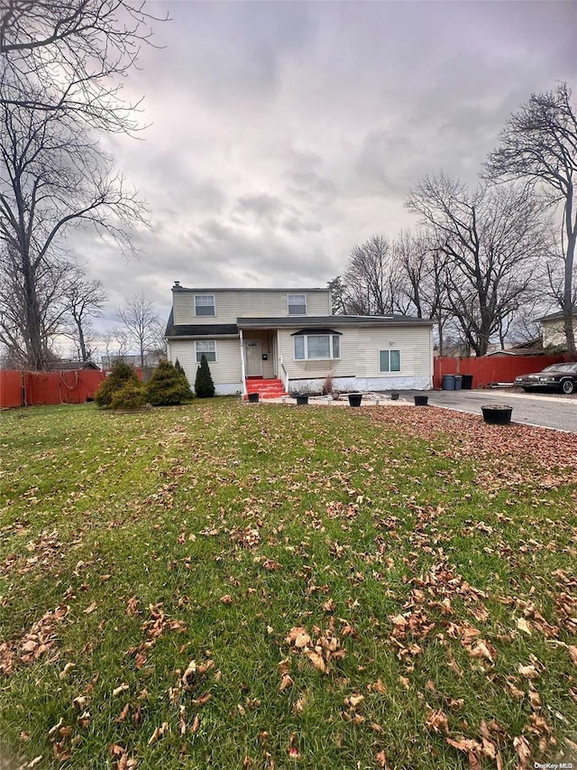 single story home featuring a front yard