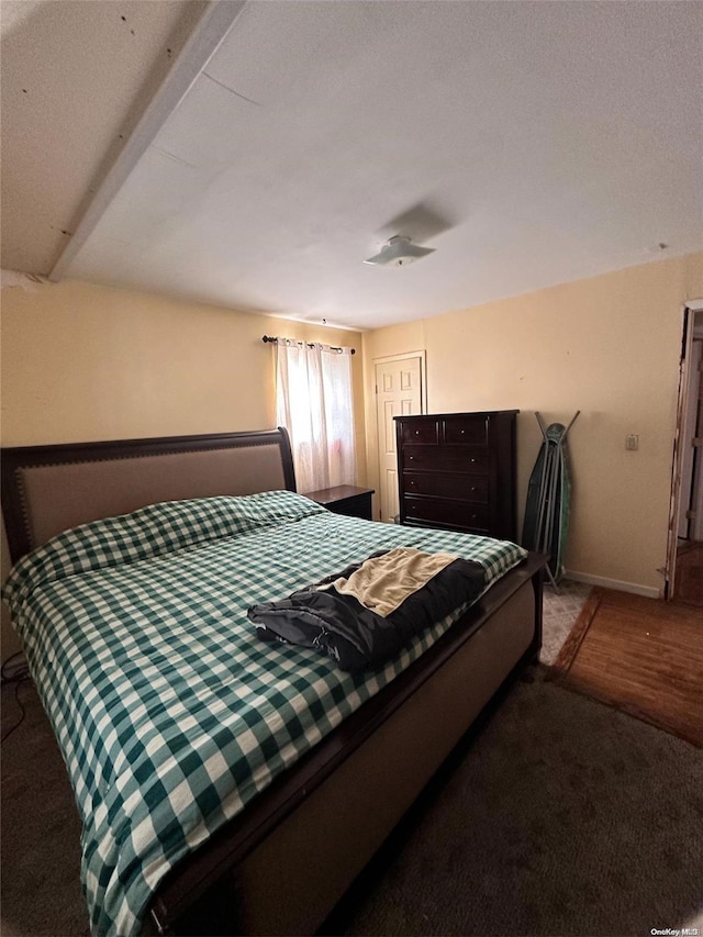 bedroom featuring a textured ceiling and carpet floors