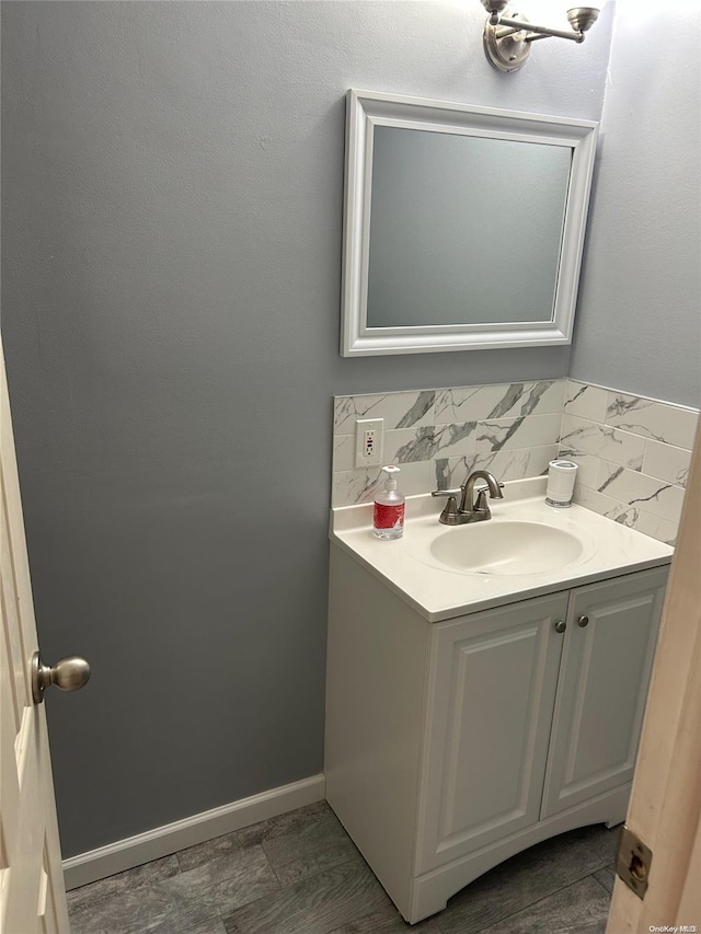 bathroom featuring decorative backsplash and vanity