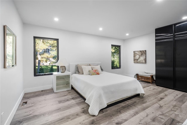 bedroom with light wood-type flooring