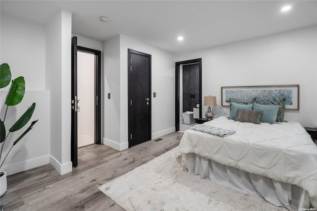 bedroom featuring light hardwood / wood-style flooring