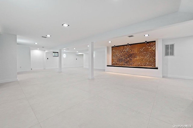 basement featuring light tile patterned flooring