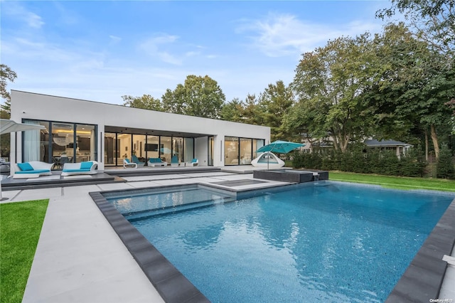 view of swimming pool with a patio area