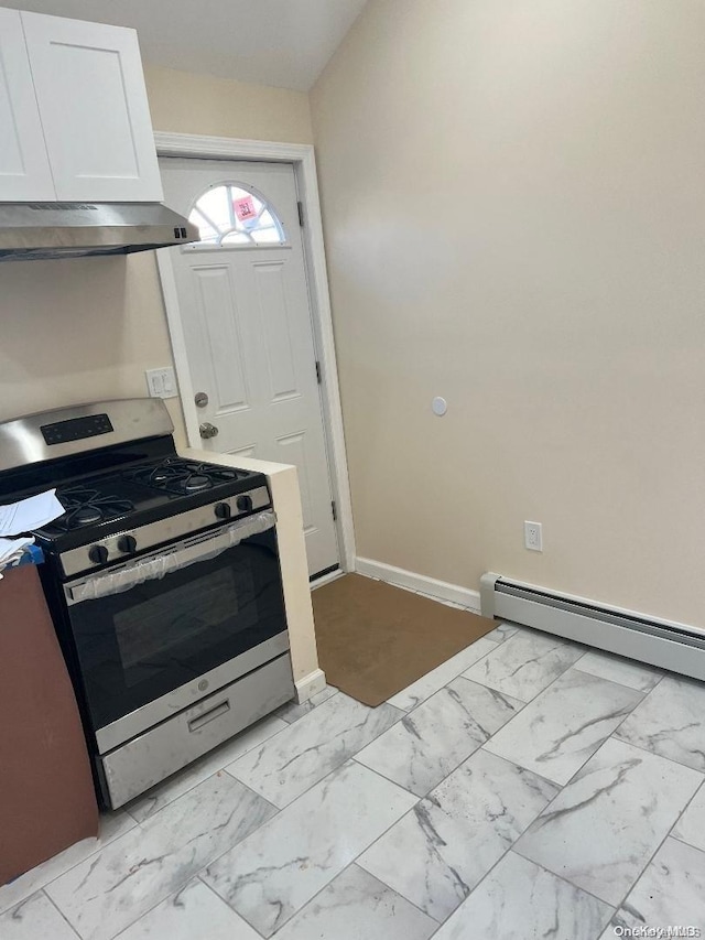 kitchen featuring white cabinetry, exhaust hood, a baseboard heating unit, and stainless steel gas range