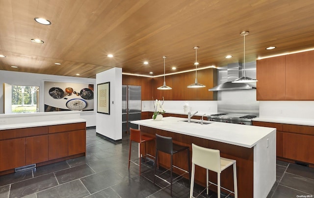 kitchen with sink, wall chimney exhaust hood, pendant lighting, a kitchen island with sink, and wood ceiling