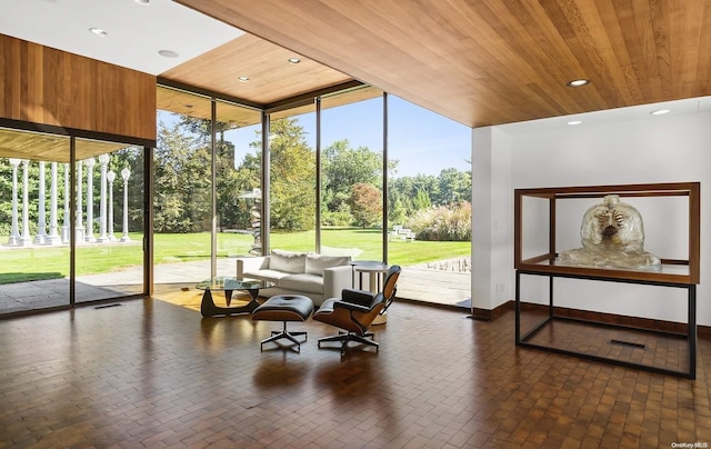 interior space with wooden ceiling and a healthy amount of sunlight