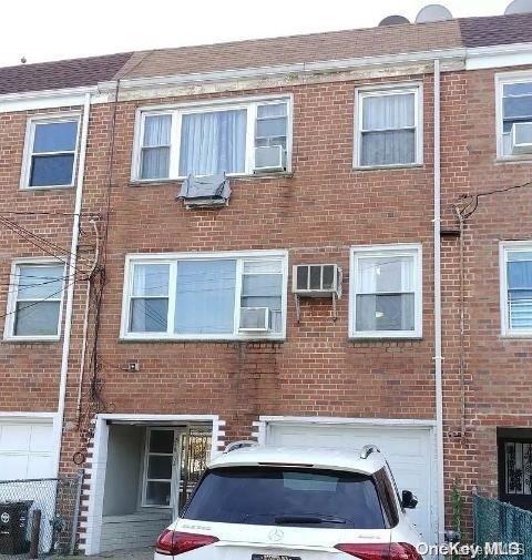 view of property with central AC unit and an AC wall unit