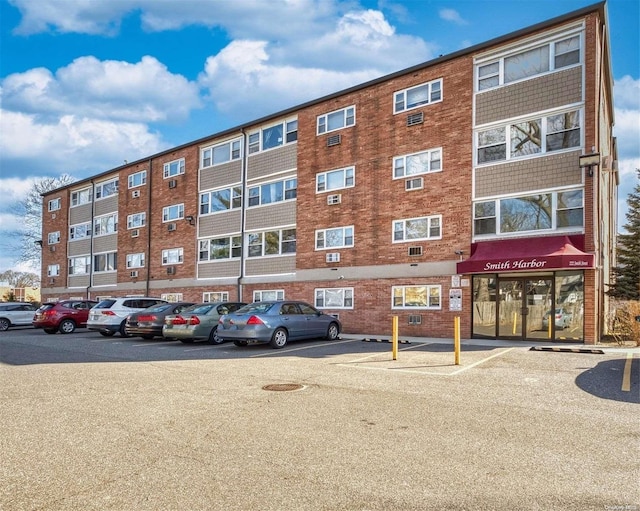 222 Smith St Unit 3C, Freeport, NY 11520 - view of property featuring uncovered parking