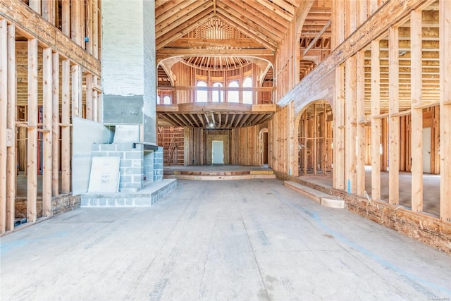 miscellaneous room featuring high vaulted ceiling