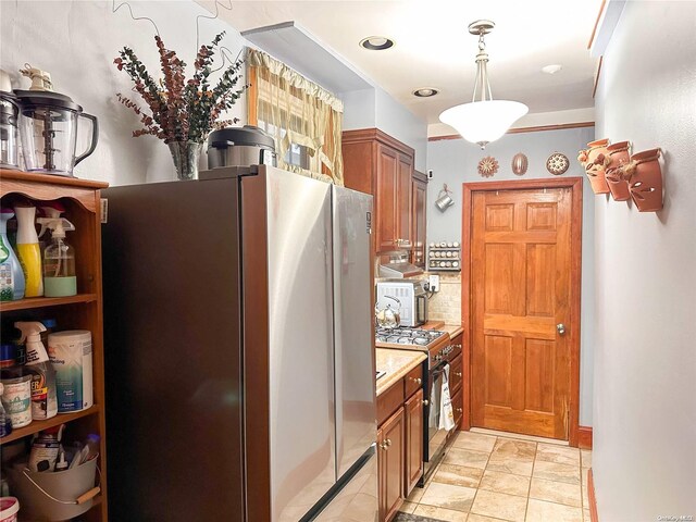 26-44 92nd St, Flushing, NY 11369 - kitchen featuring pendant lighting, backsplash, and stainless steel appliances