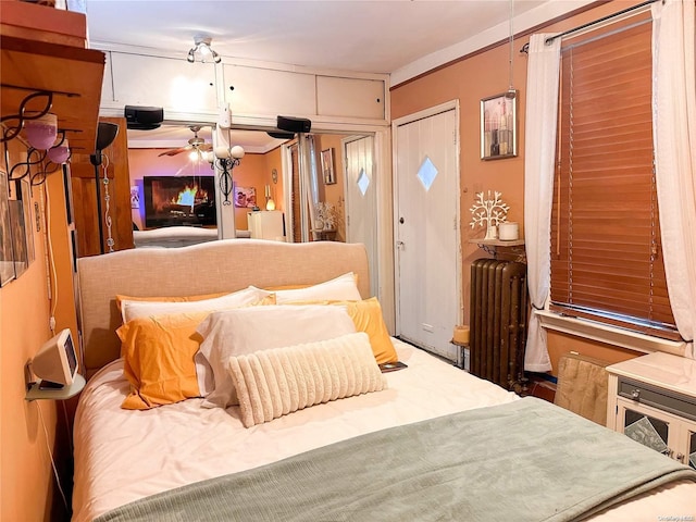 26-44 92nd St, Flushing, NY 11369 - bedroom with radiator heating unit, crown molding, and a closet
