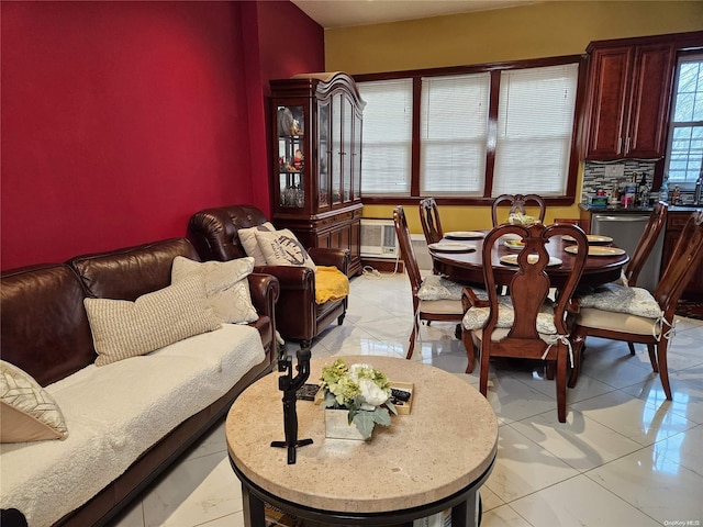 dining space featuring light tile patterned floors