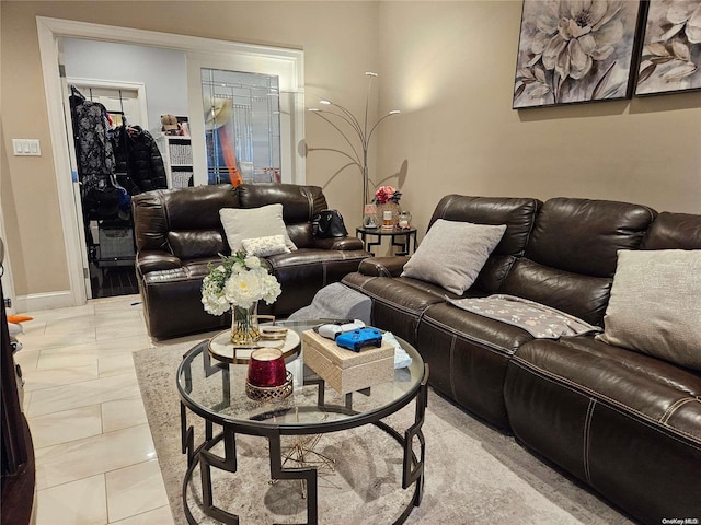 living room with light tile patterned flooring