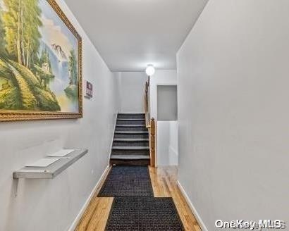 hallway featuring wood-type flooring