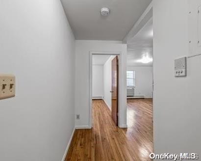 corridor featuring light hardwood / wood-style flooring